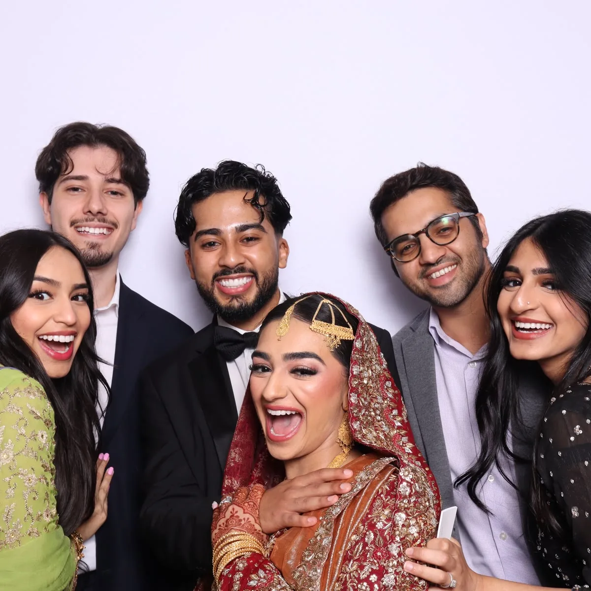 Guests using Clutch City luxury photo booth at Houston wedding